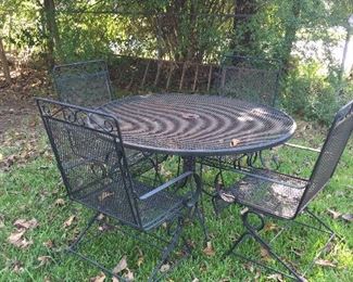 Another garden table with four chairs