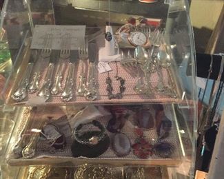 Sterling flatware is "Joan of Arc" by International Sterling and there are 18 pieces.  Belt buckle collection and wonderful stones