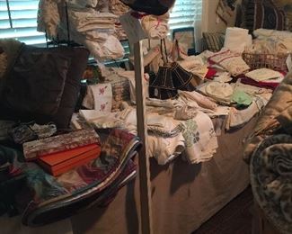 Wonderful hat stand, and lots of vintage linens