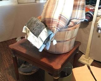 Vintage side table with metal accents, wool covered cushions, throws