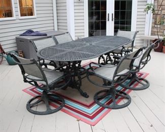 Metal patio set with 6 swivel chairs