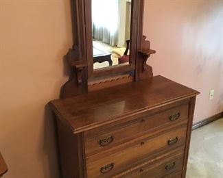 Antique all wood dresser with tilt mirror.  39"L x 69" h (with mirror) x 17"w.  Good condition!  $125