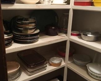 Lots of kitchen dishes, Pyrex, Tupperware, silverware, and the list goes on!