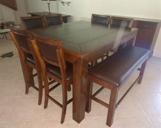 6 bar height stools, Bench, and beautiful table! Looks brand new straight out of the show room!