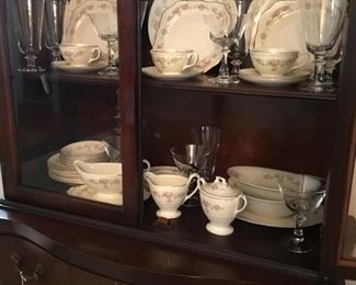 The set of Homer Laughlin China in other China cabinet with crystal glasses.