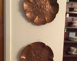Copper wall hangings.