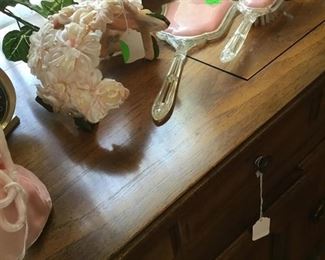 Old mirror and brush in pink with pink hat and pink bag.