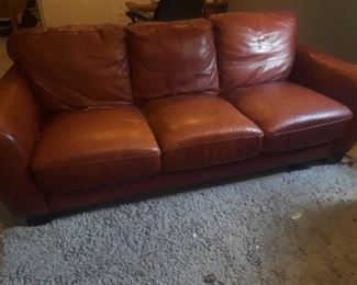 Leather sofa and matching chair.  Chair has some damage. 