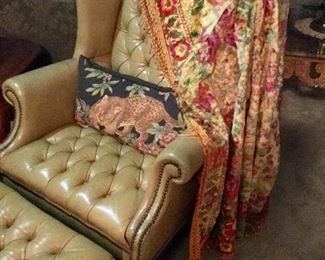 Antique fringed coverlet, Leather wingback chair with ottoman