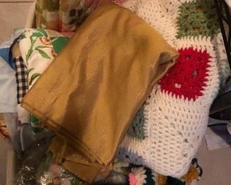 Crocheted afghans, quilt cutter, pillow shams