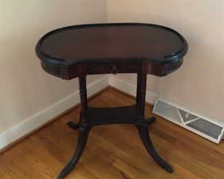 Kidney shaped end table. We have a pair. Sold separately.