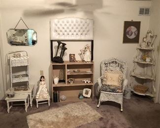 Twin tufted headboard, wicker rocker. Stacking tables, Victorian corner shelf. Shag rug.