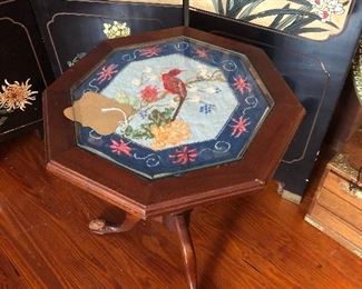 Small table, needlepoint. Note the chewed foot on the left.