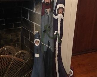 Cypress knee painted as Carolers. Very tall, hand painted.