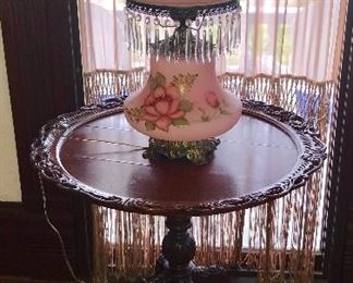 Antique hand painted lamp, carved mahogany pie crust table