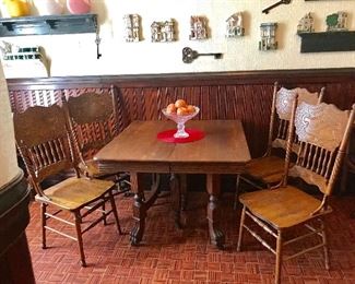 Antique oak table and pressed back chairs