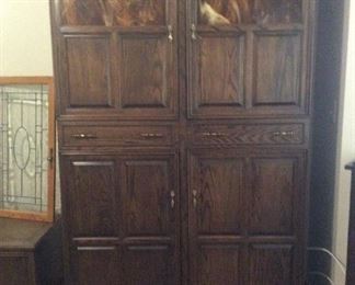 Armoire with glass inset at top