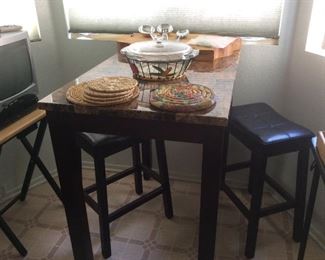 Granite topped table with two stools