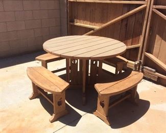 Round wood outdoor picnic table