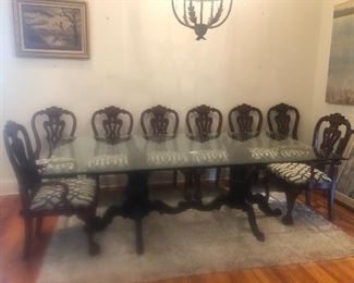 Glass top dining table with 8 upholstered chairs