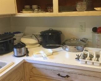 Stainless skillet by  Cuisinart 
Oval Crockpot 
Enamelware etc...