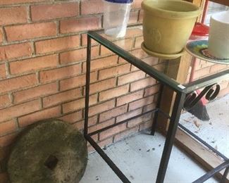 Millstone
Iron and glass table 