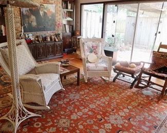 Large 1920's rockers and floor lamp.  Ruth Tear's "The Politician" painting on wall behind