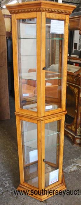  NEW Octagon Shape Lighted Mirror Back Display  Door Glass Shelved Cabinet in the Oak Finish by “Home Meridian”

Located Inside – Auction Estimate $100-$200 