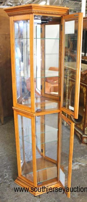  NEW Octagon Shape Lighted Mirror Back Display  Door Glass Shelved Cabinet in the Oak Finish by “Home Meridian”

Located Inside – Auction Estimate $100-$200 