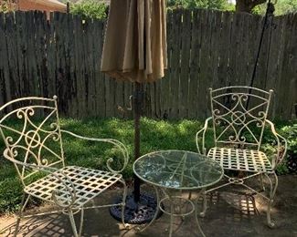 3 outdoor chairs, glass top table and umbrella