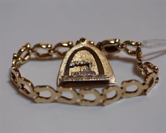 St. Louis charm 14 kt. yellow gold bracelet.  