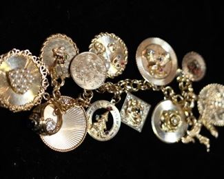 Mostly 14kt. yellow gold, ladies' charm bracelet.  