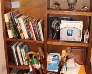 Books, albums,  canes and cane holder.