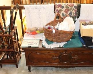 Antique cedar chest, linens, cane holder with canes.  