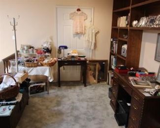 This library/office is full of linens, books, new product, and office supplies.  