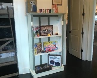Antique bookcase , books and games 