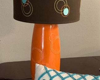 mid century orange ceramic lamp with pillow