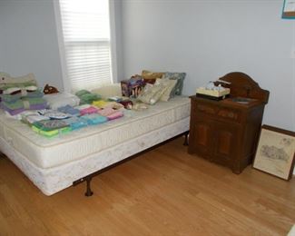 bed frame, linens, washstand