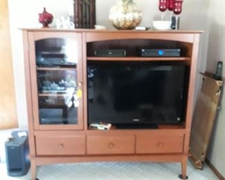 entertainment center  ,  flat screen TV, sound system