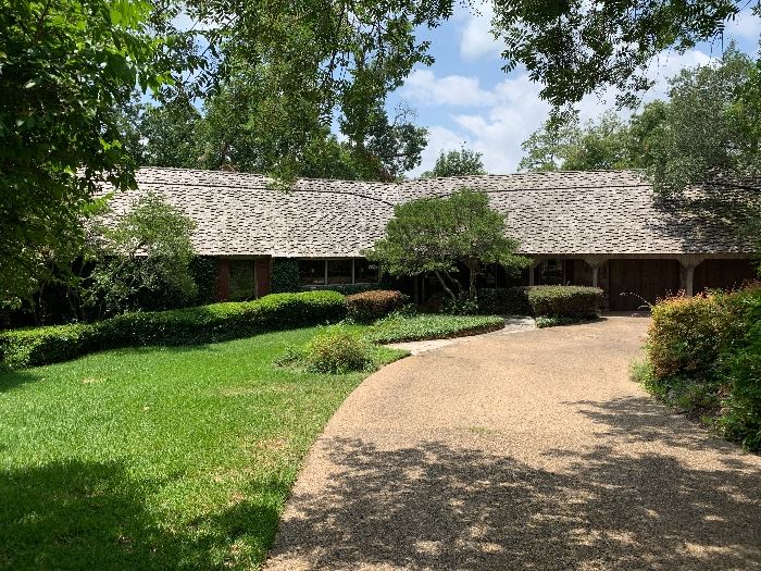 Unique English -Style Cottage in Lakewood featuring hand hewn cedar shake exterior