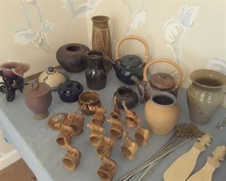 Larger Overview of Ceramic and Pottery Tea Pots, Vases, Pitchers, Wine Souvenir, African folk art carved animal napkin ring holders, skewers set, the letter N, souvenir salad set of 2, silver plated trivet holder, various picture frames, Asian Teapot Set with tea cups and creamer.