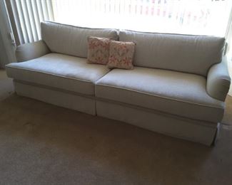 Oversized Beige Couch 2 Seater, one small spot. 2 pillows.
