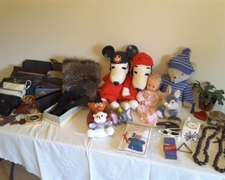 Collection of small handbags and purses. Vintage Snoopy Dolls and Collectible Dolls and Special Collectibles and Travel Souvenirs, Monkey Pod Necklaces.