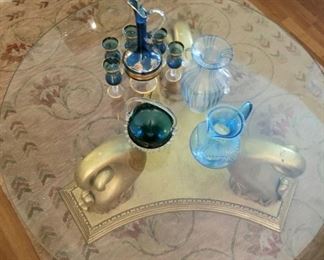 Glass top coffee table with gold pedestal base