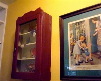 Vintage hanging cabinet and antique print.
