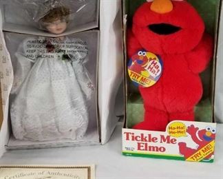 Tickle me Elmo and Porcelain Doll