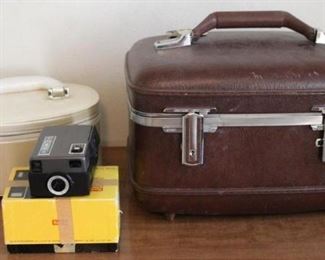 Vintage movie camera, luggage makeup cases
