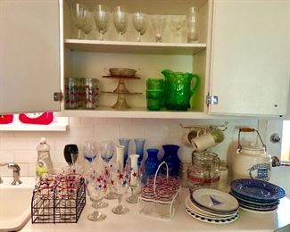 Glassware and bar ware, vintage cake stands, vintage pitchers cups, wine glasses, assorted vintage plates, crock, vases 
