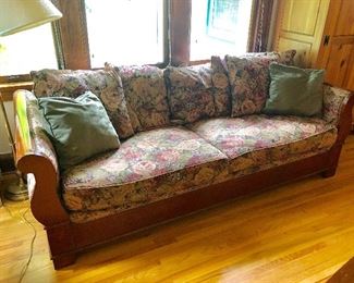 Vintage shabby chic floral sofa with pillows