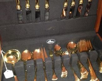 Set of goldware in case